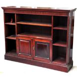 An Edwardian mahogany open bookcase, the