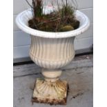 A white painted cast iron garden urn rai