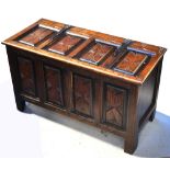 A 20th century carved oak coffer, width