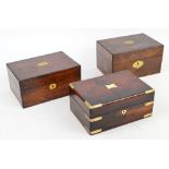 Three Victorian rosewood and walnut veneered boxes with hinged lids, each centred with a brass