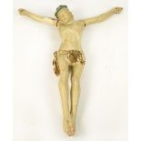 A large 17th/18th century painted pine figure of Christ, modelled as if upon the cross, height 80cm.