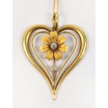 A 15ct gold heart shaped pendant centred