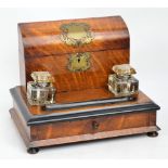 A Victorian oak ink stand with domed hin