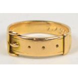 A 15ct yellow gold ring in the form of a belt with a buckle, size L/M. CONDITION REPORT: Weight