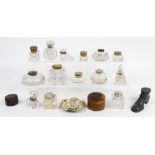 A group of ink wells including a glass e