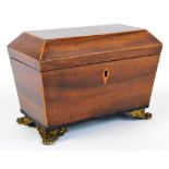 A 19th century mahogany veneered tea caddy of sarcophagus form with satinwood inlaid escutcheon