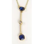 An 18ct gold drop pendant set with a cus