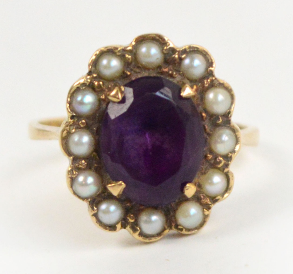 A yellow metal amethyst and pearl ring,
