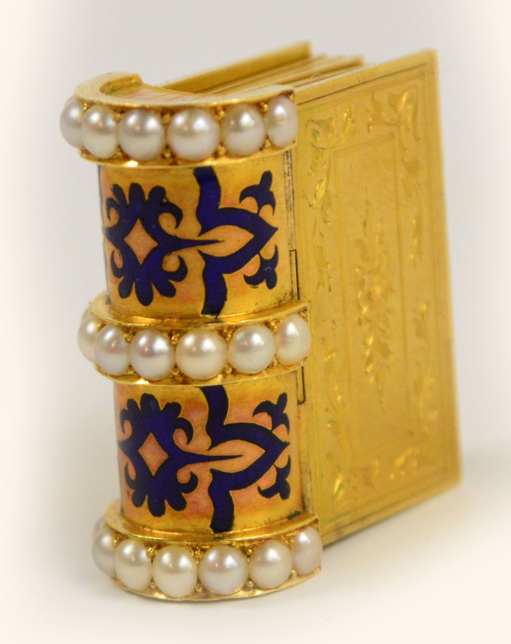 An unusual Victorian unmarked yellow metal bracelet modelled as a book, composed of blue enamel - Image 2 of 2