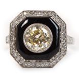 A good 18ct white gold Art Deco diamond and black onyx ring, the central brilliant cut stone