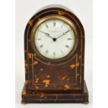 A late 19th century tortoiseshell and silver string inlaid mantel timepiece with curved top and