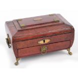 A Regency Moroccan leather and brass mounted work box of sarcophagus form, with twin ring handles,