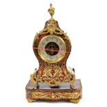 An early 20th century French boulle type mantel clock with balloon shaped case, silvered dial set