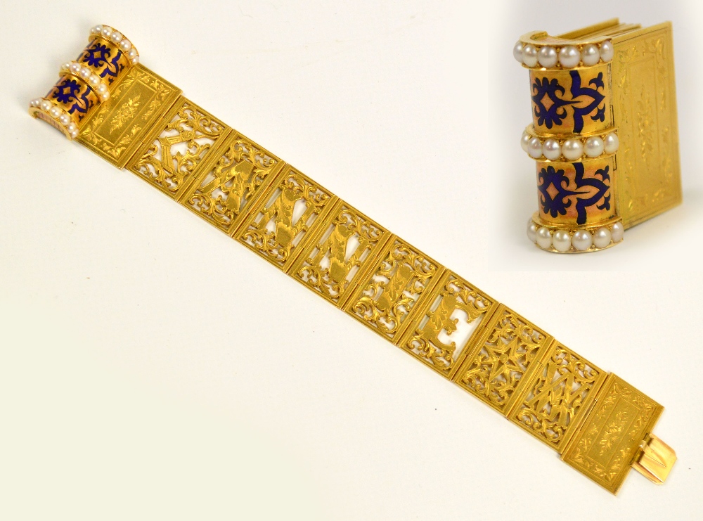 An unusual Victorian unmarked yellow metal bracelet modelled as a book, composed of blue enamel