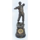 An early 20th century spelter figural eight day mantel clock surmounted with a labourer "Home In