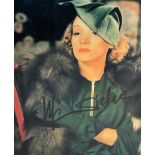 Marlene Dietrich; signed coloured photograph, 24.5 x 19cm, framed and glazed.