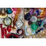 A quantity of 20th century coloured glass to include cranberry coloured dishes, cased glass vases