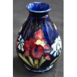 A small Moorcroft baluster vase, Iris pattern, height 11cm.