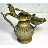 A late 19th century Tibetan cast brass incense burner decorated with temple dogs and a multi-headed