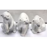 Three Lladro polar bears in various poses (3).