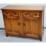 A 20th century oak sideboard, two drawers above heavily carved doors, 90 x 117cm. CONDITION REPORT
