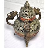 An early 20th century Sino-Tibetan white metal incense burner of baluster form decorated with