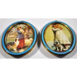 A pair of late 19th century oval brass miniature frames with band of blue decoration, both now