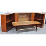 A retro Italian coffee table with lower rattan shelf, a pair of mahogany bookcases and one other