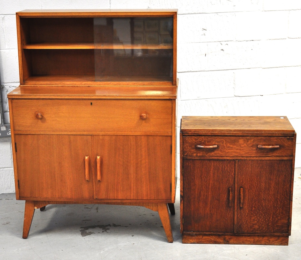 A 1970s retro light oak Golden Key side cabinet with glazed top section with internal tier and