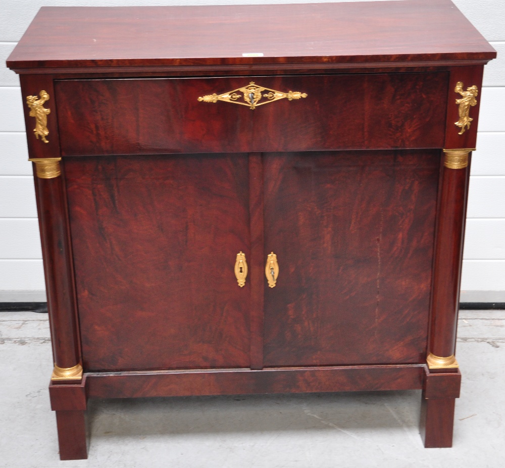 A Dutch mahogany gilt metal mounted side cabinet, the rectangular moulded top above single drawer