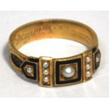 An Edwardian 15ct gold black enamelled and cultured pearl mourning ring the central rectangular