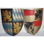 Two painted metal shields props from the television programme "Henry VIII" starring Ray Winston,