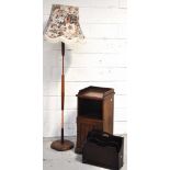 An early 20th century oak cabinet with open section above cupboard with single door bearing