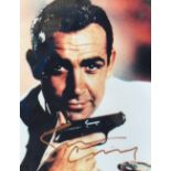 Sean Connery; a signed coloured photograph of the actor in his role of James Bond, 25 x 20cm, also