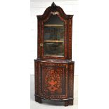 An early 19th century Dutch marquetry inlaid free standing corner cupboard, the upper glazed