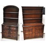 A small Ercol style oak dresser with domed plate rack and a matching larger oak dresser with plate