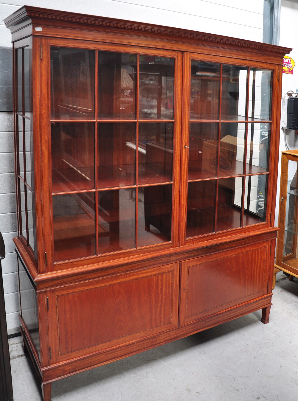 A good quality Edwardian satinwood and cross banded display cabinet, the moulded dentil cornice