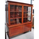 A good quality Edwardian satinwood and cross banded display cabinet, the moulded dentil cornice