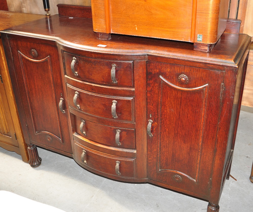 A mid 20th century oak sideboard, width 123cm and a mahogany side table (2).