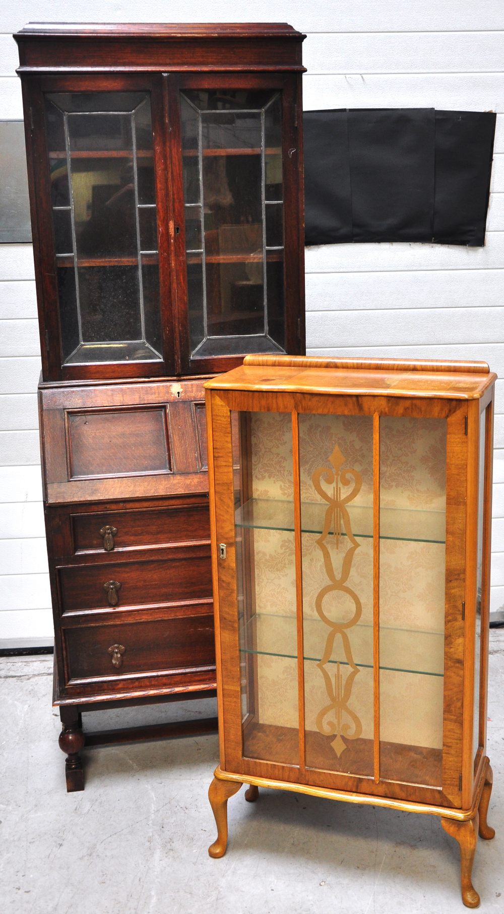 A 1940s oak part glazed bureau on block supports, height 194cm and a retro display cabinet with two