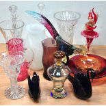 A quantity of largely coloured glassware to include a red and gilt glass Pierrot, a multi-coloured