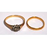 A 22ct gold wedding band (af) and a 9ct gold floral set ring, approx weight 4.3g (2).