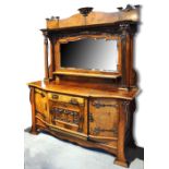 A good c.1900 Art Nouveau walnut and pollard oak mirror back sideboard, the raised back with two