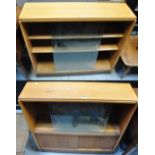 Two pale oak retro small bookcases with double glazed doors to the top and two sliding drawers to