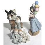 Three Lladro figures, two sleeping babies, a boy with a donkey and a girl with balloons (3).