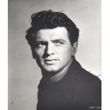 Rock Hudson; a signed black and white photograph, 22.5 x 17cm, framed and glazed.