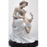 A large Lladro figure of a woman with a child, "Where Love begins", ref no.07649, no.3538/4000,