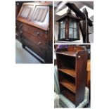 A c.1930s oak bureau, a mid 20th century oak open bookcase with three shelves and a wooden standard