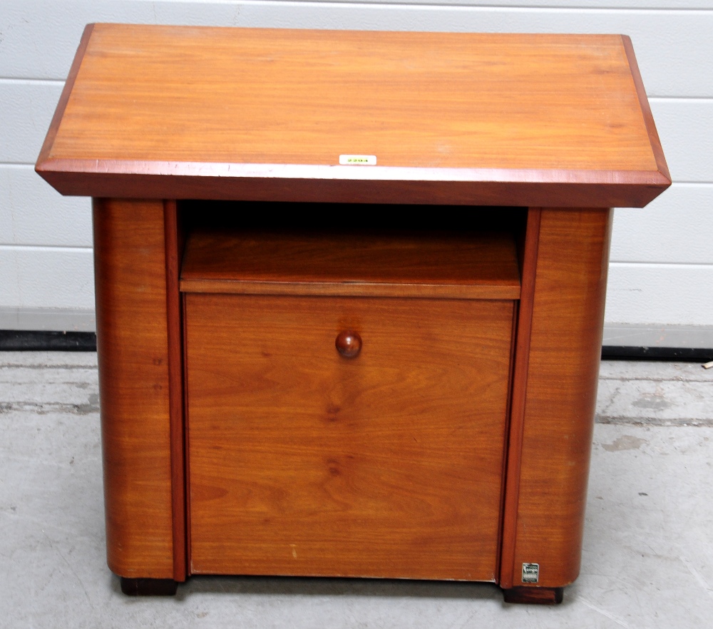 An Art Deco satin walnut magazine/side table, the moulded rectangular top above shelf and fall