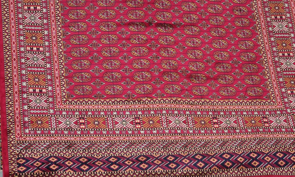 A red ground bokhara carpet, approx 280 x 200cm.